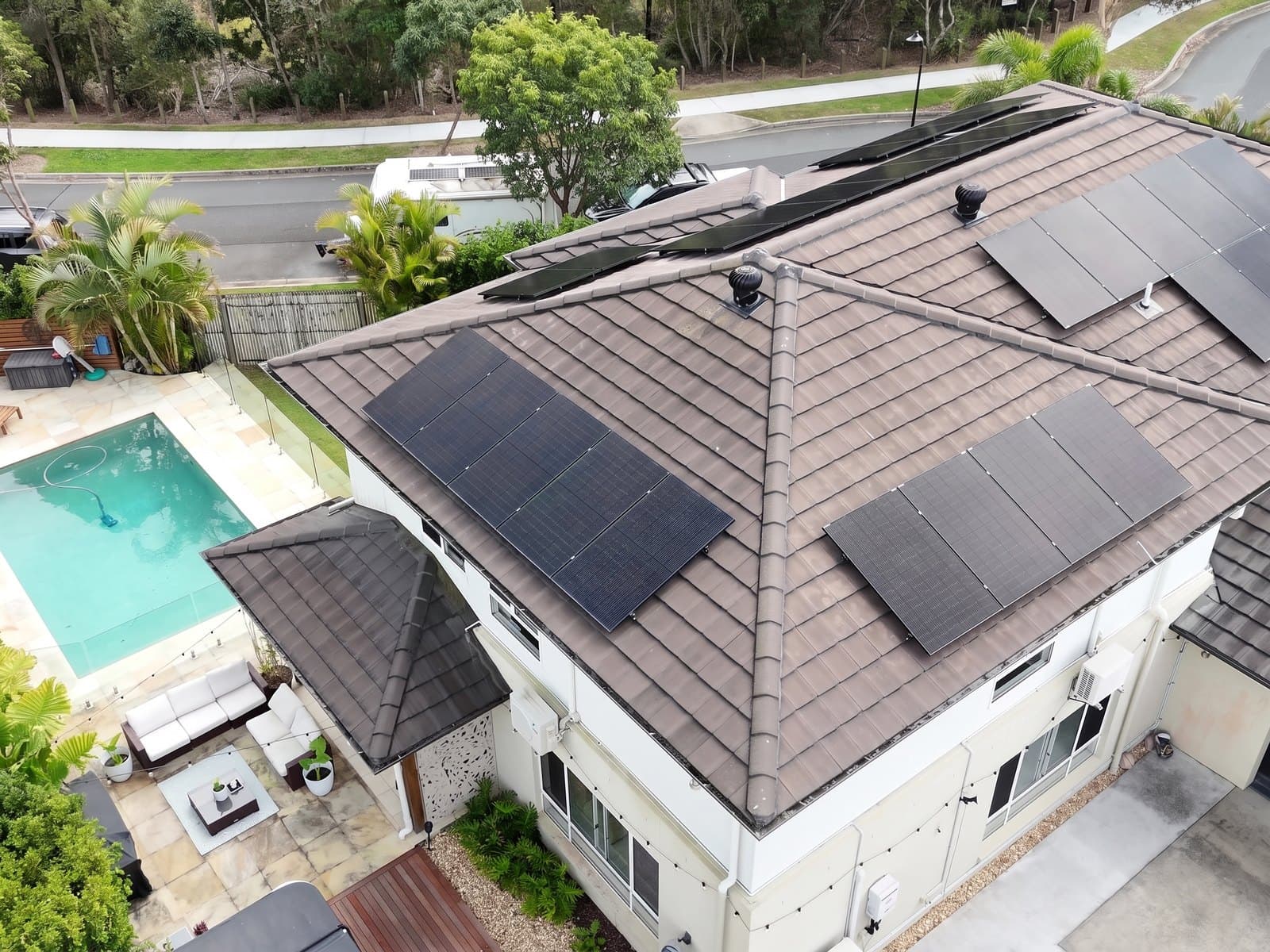 Aerial view of a home with black solar panels installed by EFS